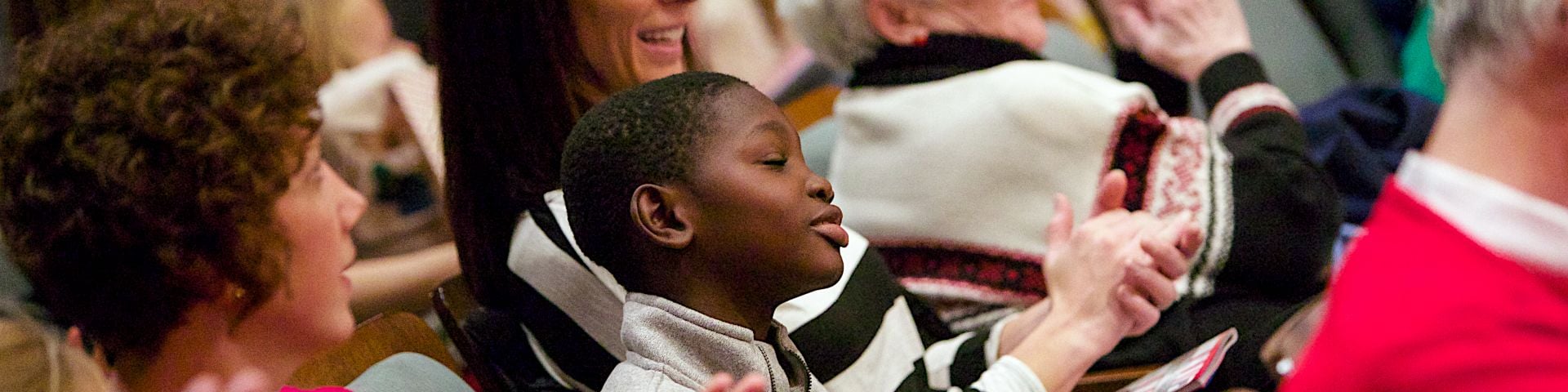 An audience applauding at a Grand Rapids Symphony concert