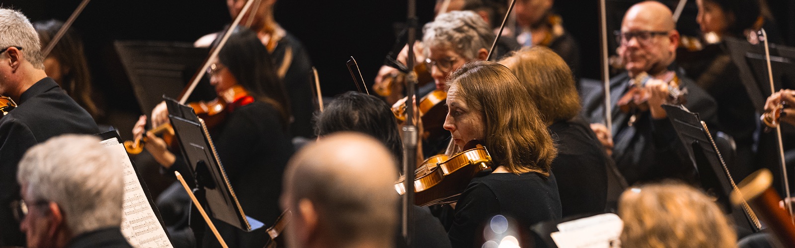 String players of the Grand Rapids Symphony performing on stage